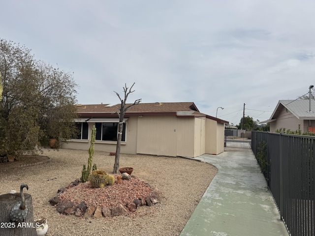 view of property exterior featuring fence