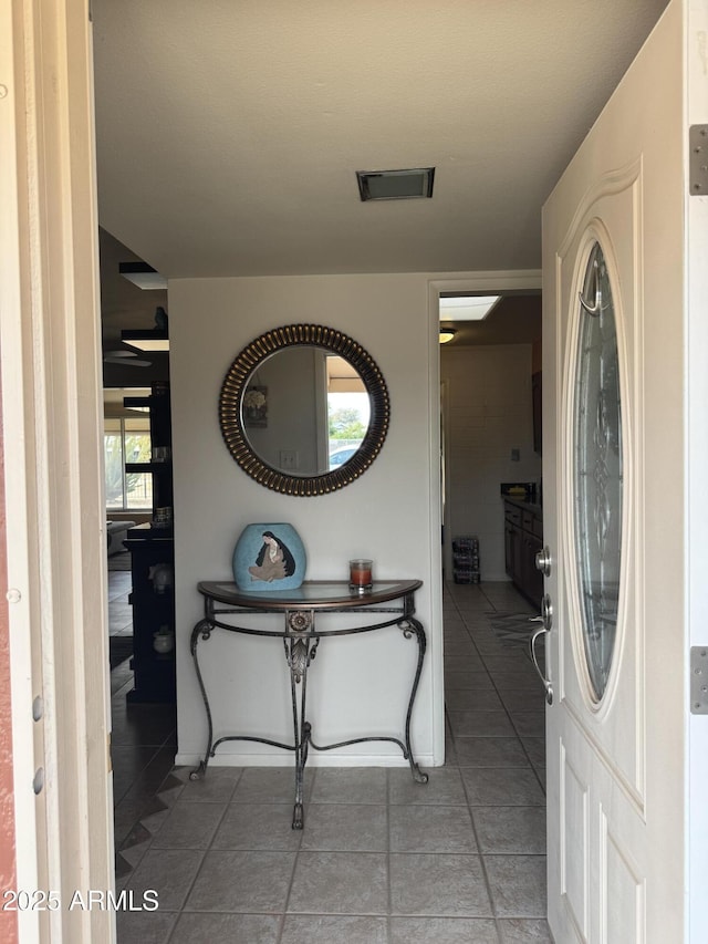 tiled entrance foyer with visible vents