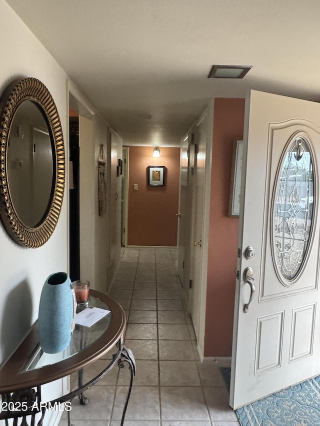 corridor with light tile patterned floors and visible vents