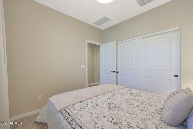 carpeted bedroom with a closet