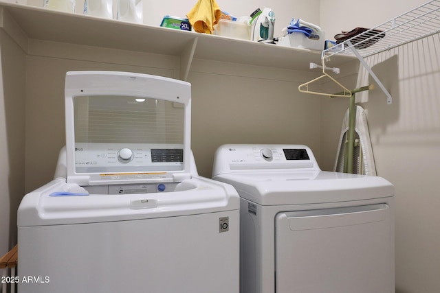 laundry room with independent washer and dryer