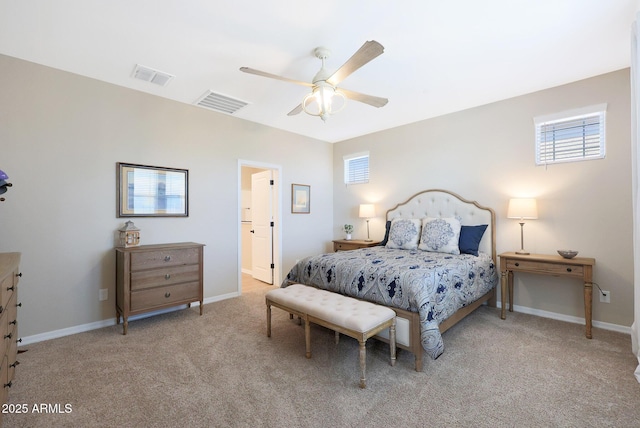 bedroom featuring multiple windows, light carpet, and ceiling fan