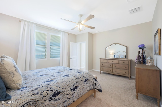 bedroom featuring light carpet and ceiling fan