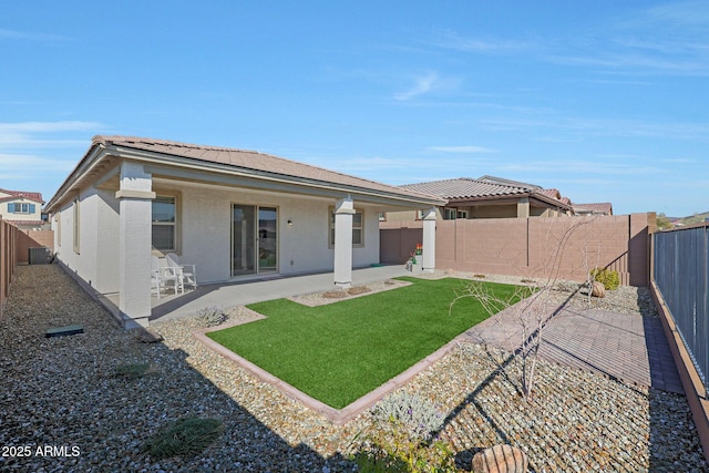 back of property featuring a yard, a patio, and central air condition unit