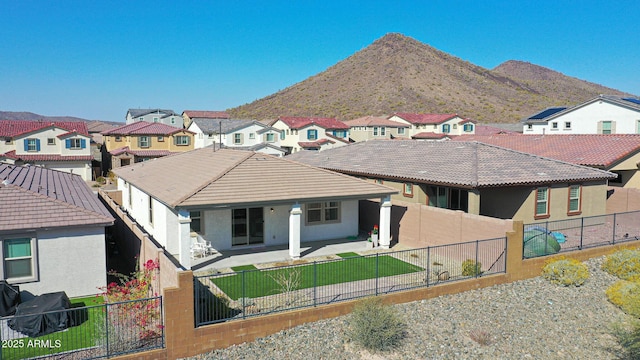 exterior space with a patio and a mountain view