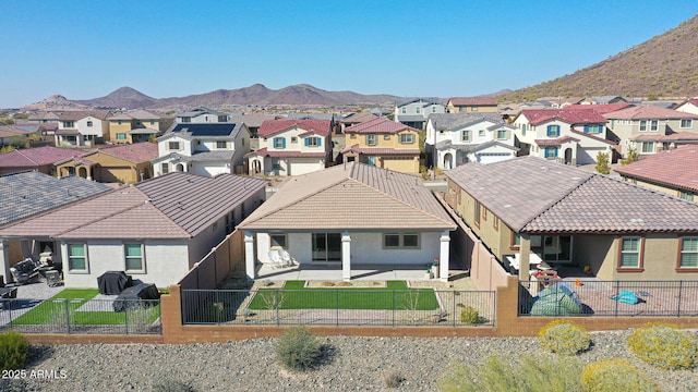 exterior space featuring a mountain view and a patio area