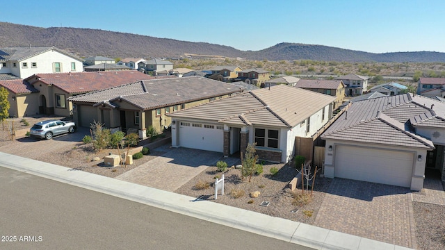 view of front of house featuring a mountain view and a garage