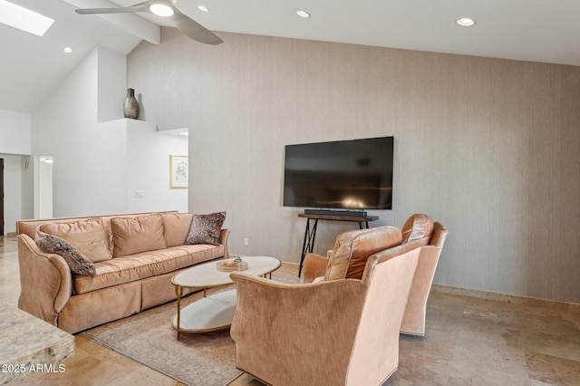 living room with beam ceiling, a skylight, high vaulted ceiling, and ceiling fan