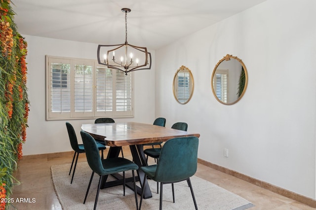 dining room featuring a notable chandelier