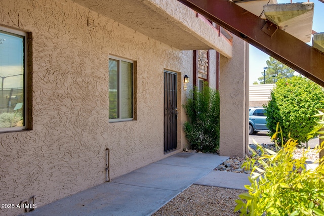 view of side of property featuring a patio area