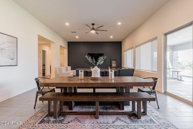 dining space featuring ceiling fan and light hardwood / wood-style floors