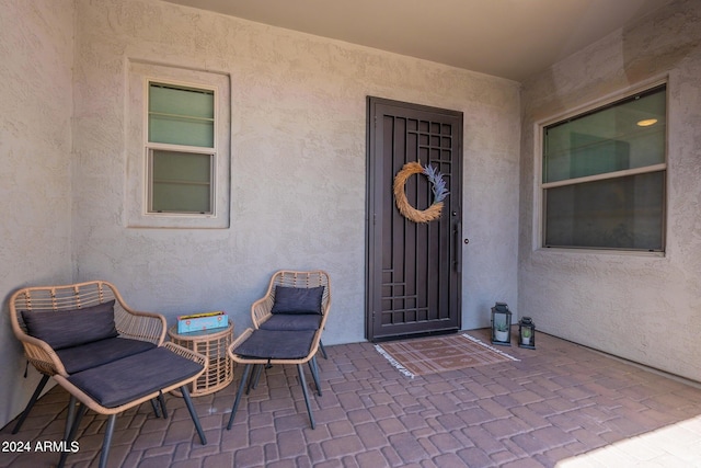 entrance to property featuring a patio area