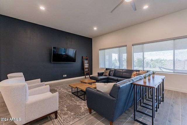 living room with ceiling fan and hardwood / wood-style floors