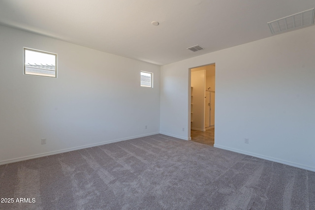 24184 W Gibson Ln, Buckeye, AZ 85326 - spare room featuring carpet and baseboards