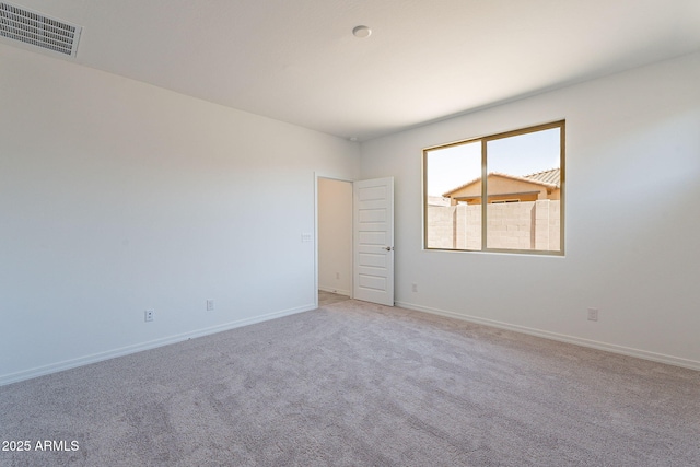 24184 W Gibson Ln, Buckeye, AZ 85326 - unfurnished room with baseboards and light colored carpet