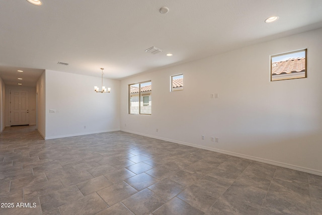 24184 W Gibson Ln, Buckeye, AZ 85326 - empty room featuring a chandelier and recessed lighting