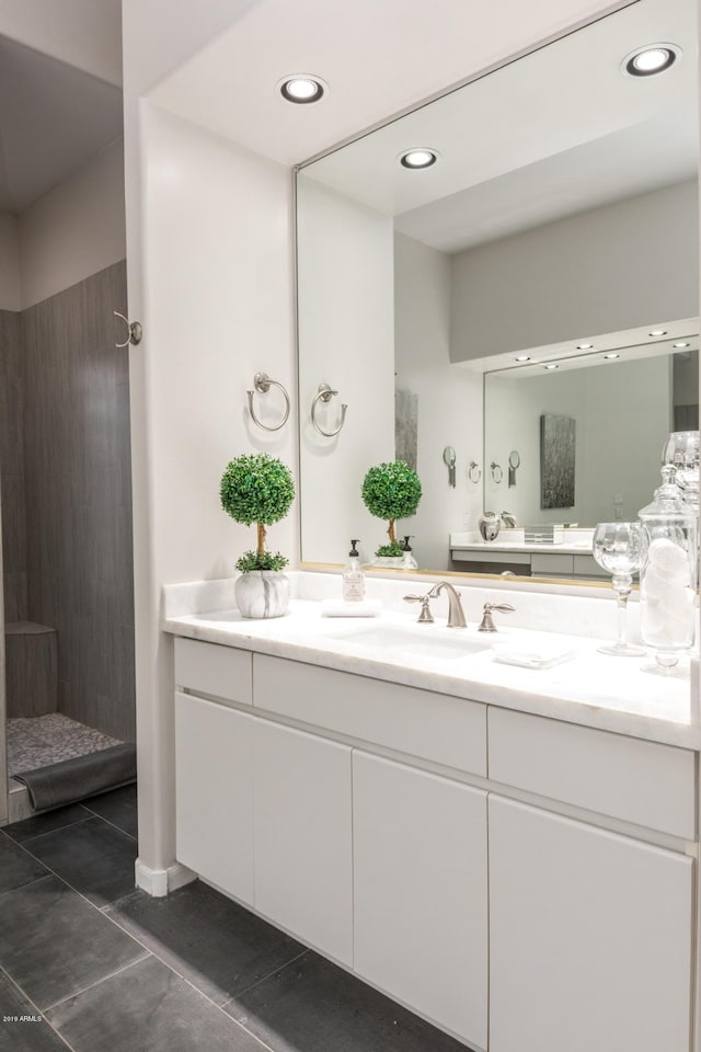 bathroom featuring tile patterned floors, recessed lighting, and vanity