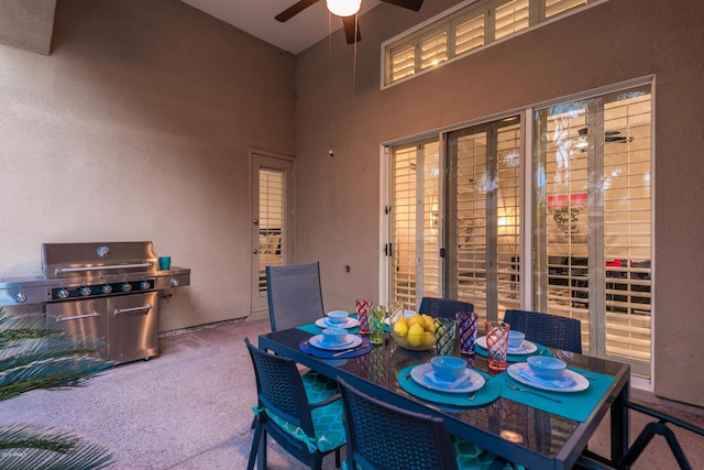 dining room featuring ceiling fan and carpet