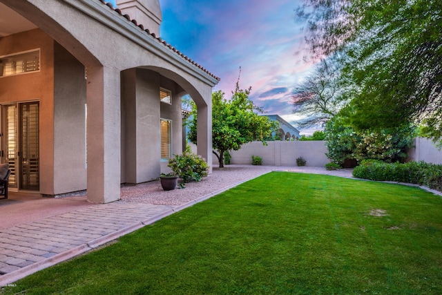 view of yard featuring a patio and fence