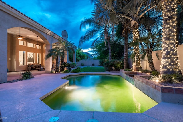 view of pool with a patio, a fenced backyard, a fenced in pool, and ceiling fan