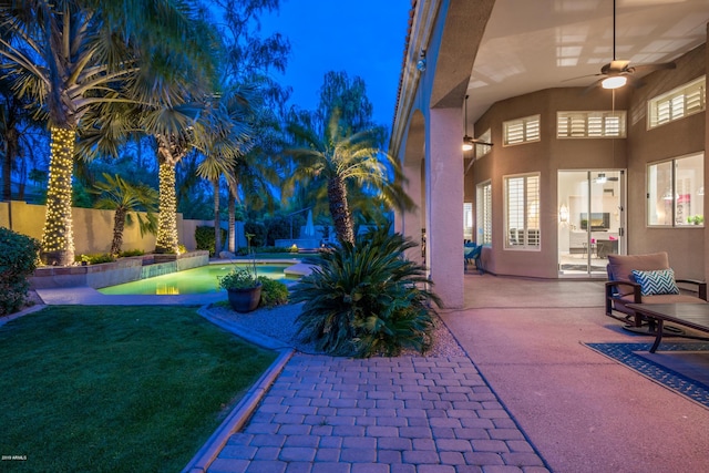 view of patio / terrace with a fenced backyard and a ceiling fan