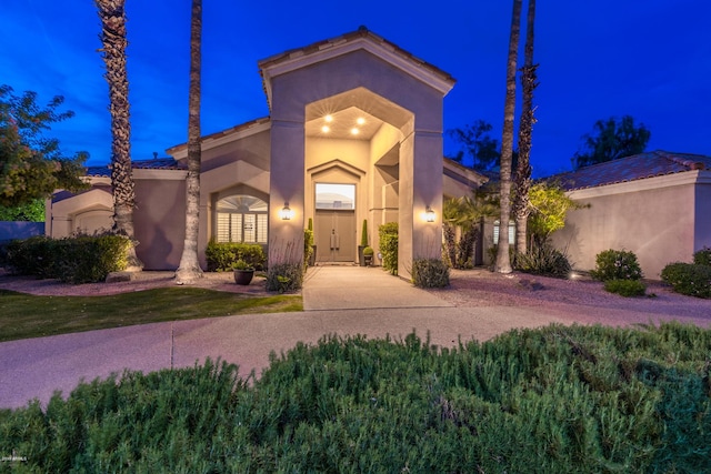 view of front of house featuring stucco siding