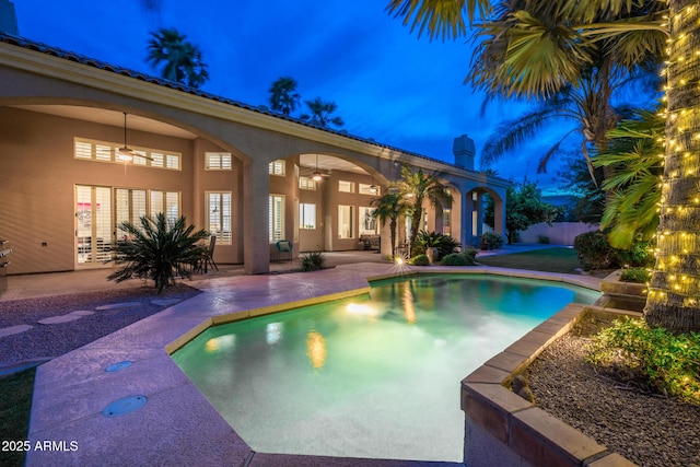 view of swimming pool with a fenced in pool, a patio, a ceiling fan, and fence