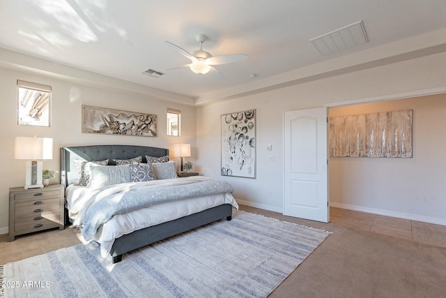 bedroom with light colored carpet and ceiling fan