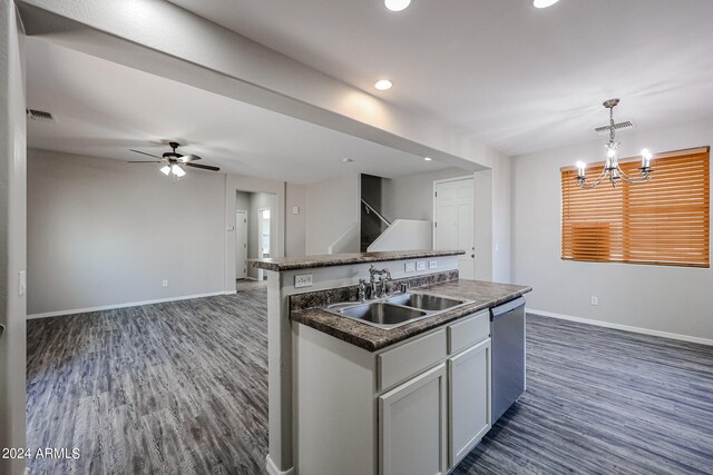 kitchen with sink, decorative light fixtures, a kitchen island with sink, dishwasher, and dark hardwood / wood-style floors