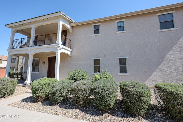 view of home's exterior featuring a balcony