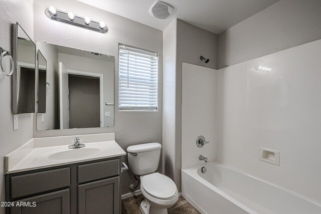 full bathroom featuring tub / shower combination, vanity, tile patterned flooring, and toilet