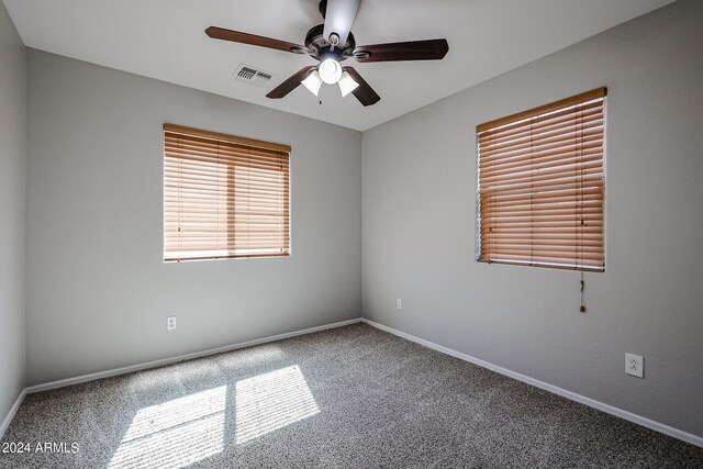 empty room featuring carpet and ceiling fan