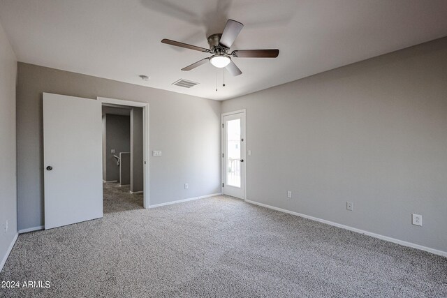 empty room with carpet flooring and ceiling fan