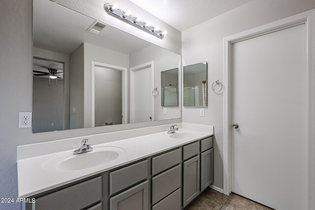 bathroom with tile patterned floors, ceiling fan, and vanity