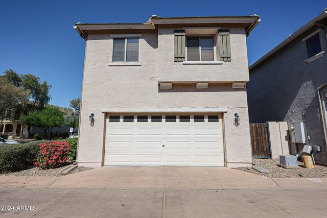 front of property with a garage