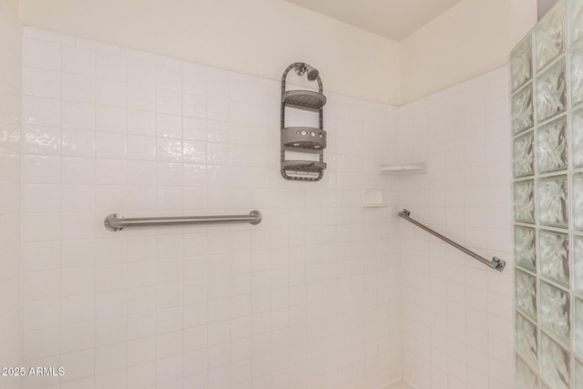 bathroom with a tile shower