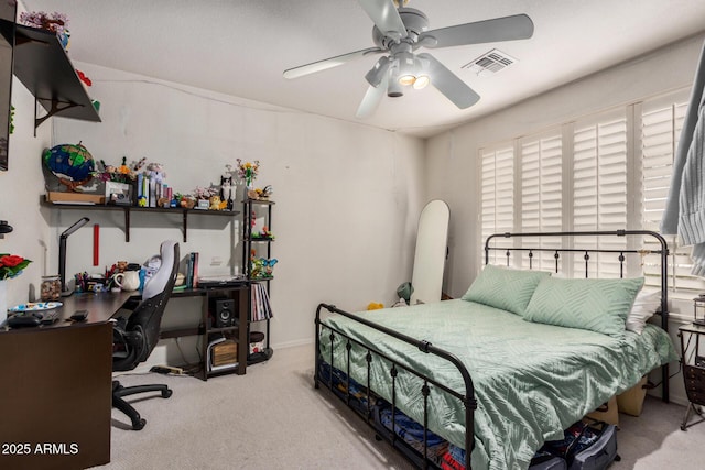 bedroom with carpet floors, visible vents, and a ceiling fan