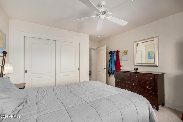 bedroom with carpet, a closet, and ceiling fan