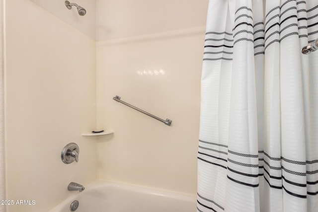 full bath featuring shower / bath combo with shower curtain