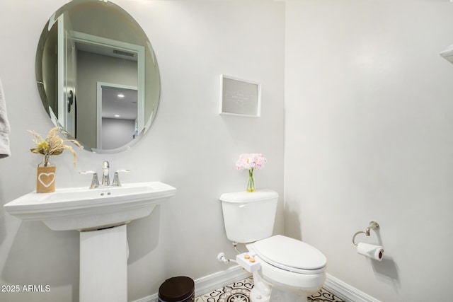 8772 W Brooklite Ln, Peoria, AZ 85383 - bathroom featuring toilet and baseboards