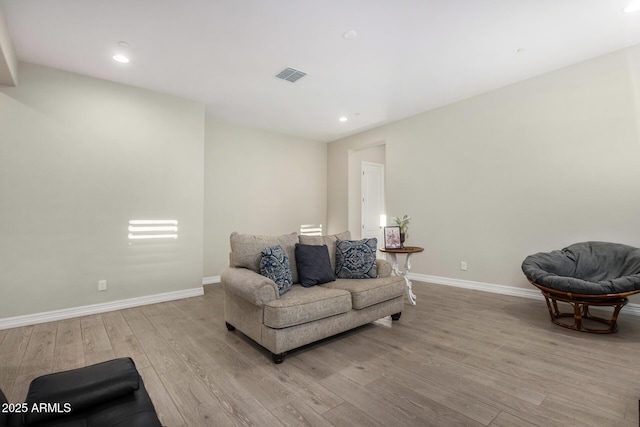 8772 W Brooklite Ln, Peoria, AZ 85383 - living area featuring wood finished floors, baseboards, and recessed lighting