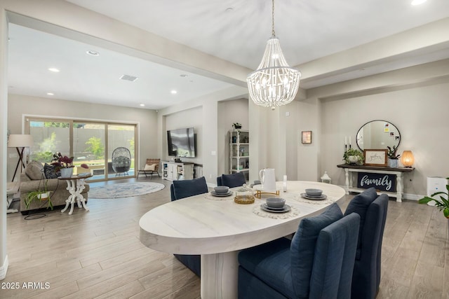 8772 W Brooklite Ln, Peoria, AZ 85383 - dining area featuring wood finished floors, a chandelier, and recessed lighting