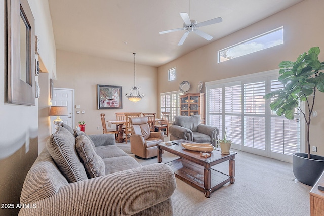 11260 N 92nd St Unit 2111, Scottsdale, AZ 85260 - living room featuring plenty of natural light, light carpet, a ceiling fan, and a towering ceiling