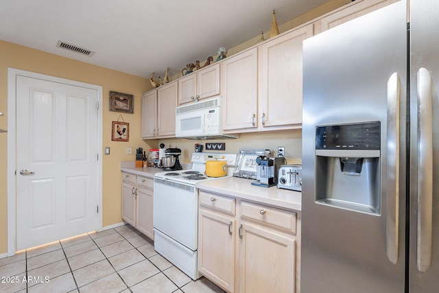 11260 N 92nd St Unit 2111, Scottsdale, AZ 85260 - kitchen featuring white appliances, light tile patterned floors, and light countertops