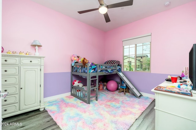 bedroom with ceiling fan and light hardwood / wood-style flooring