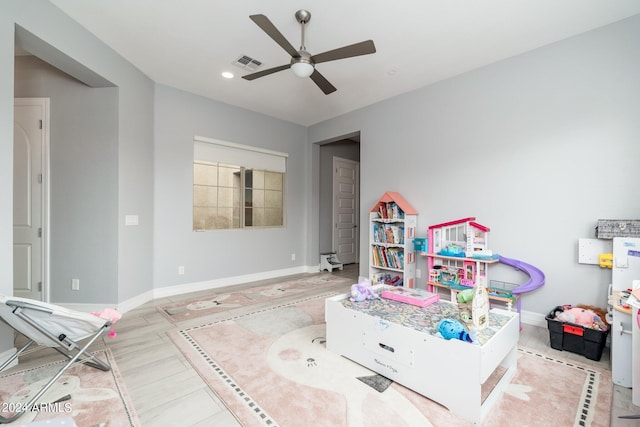 game room featuring ceiling fan and light wood-type flooring