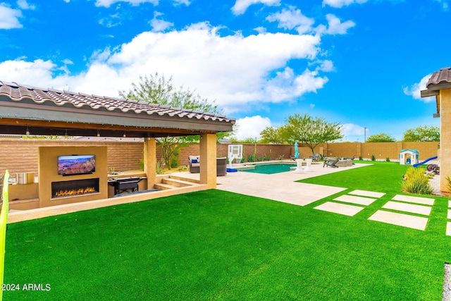 view of yard featuring a gazebo, a patio, a fenced in pool, and a fireplace