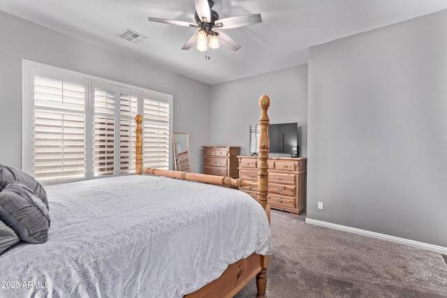 carpeted bedroom featuring baseboards and a ceiling fan