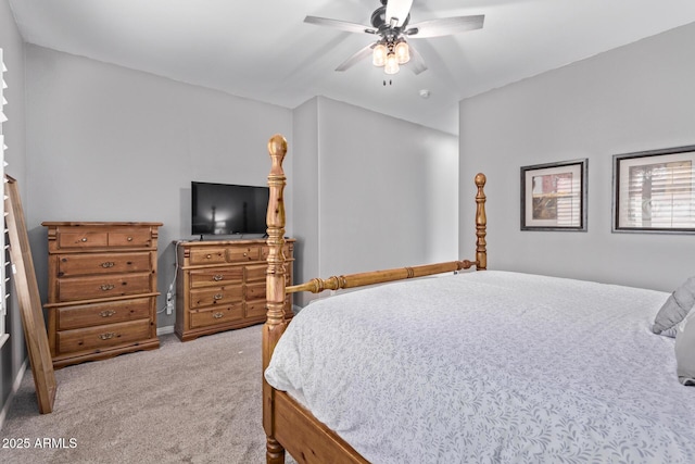 bedroom featuring light colored carpet and a ceiling fan