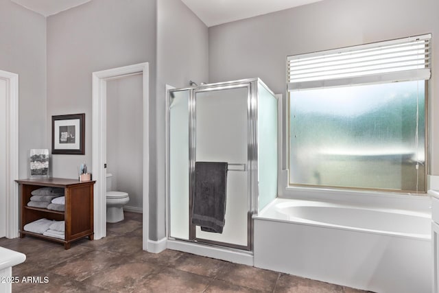 bathroom featuring toilet, a shower stall, a bath, and baseboards